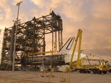 Puffy pink clouds form a canopy over the Space Shuttle Endeavour as processing continues in the Mate-Demate Device at NASA Dryden Flight Research Center in preparation for its ferry flight back to the Kennedy Space Center.