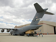 Mirror for NASA's Stratospheric Observatory for Infrared Astronomy is unloaded from Air Force C-17 transport plane.