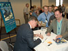 Author Dennis Jenkins autographs his works on the X-15.