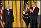 President George W. Bush applauds former Prime Minister John Howard after presenting the Australian leader with the 2009 Presidential Medal of Freedom during ceremonies Tuesday, Jan.13, 2009, in the East Room of the White House. White House photo by Chris Greenberg