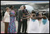 President George W. Bush and Mrs. Laura Bush are welcomed Tuesday, Feb. 19, 2008 by Rwanda President Paul Kagame and his wife, Jeannette Kagame, on their arrival to Kigali International Airport in Kigali, Rwanda.