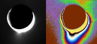 Plumes of icy material extend above the southern polar region of Saturn's moon Enceladus as imaged by the Cassini spacecraft in February 2005. The monochrome view is presented along with a color-coded version on the right.