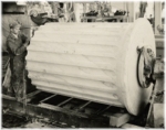 1933 photo of Vermont Marble Co. craftsman measuring Corinthian column for the Supreme Court Building.