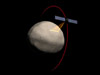 Artist concept showing the Dawn spacecraft orbiting Vesta.