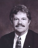 Commissioner Raymond E. Sines