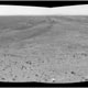 This mosaic of images shows a sweeping horizontal panorama in black and white from a hill on the right to a basin on the left.