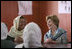 Mrs. Laura Bush smiles as she meets Sunday, June 8, 2008, with female graduates of the Police Training Academy in Bamiyan province in Afghanistan. With her is Bamiyan Governor Habiba Sarabi.