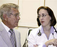 Image of elderly patient consulting with his doctor.