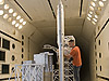 Engineer Tom Ivanco inspects the Ares I-X scale model launch tower between tests in Langley's Transonic Dynamics Tunnel