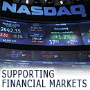 supporting financial markets -image with screens on wall street