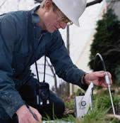 worker sampling soil