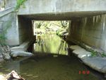 Location 12 - Looking upstream at Dogwood Run under SR 545 bridge, large concrete bags to protect road abutments, stalactites hanging from bridge deck