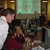 In this photo, several HiRISE team members hover around a computer screen looking at the first image from HiRISE.