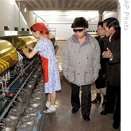In undated Korean Central News Agency photo released 16 Jan 2009, North Korean leader Kim Jong-Il, wearing glasses, visits  Pyongyang Silk Mill<br /><br />