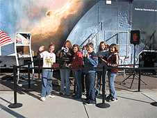 Watertown, SD – Students show off their NASA goodies while waiting in line to experience the Exploration exhibit.