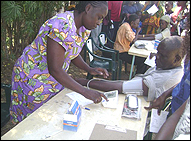 Photo: Nurse taking the blood pressure of a patient