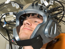 Man wearing helmet participates in experiment.