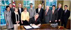 President Bush Signs GINA into law