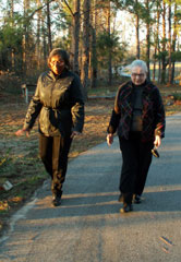 Photo of Doris Smith walking with Vee Stalker.