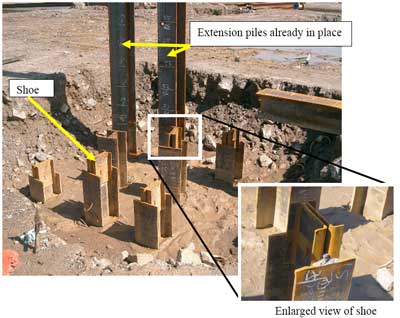 Pit with two extension piles in place and other piles with shoes welded