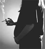 Photo of a pregnant woman smoking