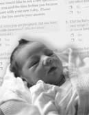 Photo of a newborn baby and a PRAMS questionnaire