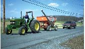 Tractor traveling on highway