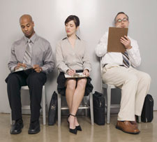 photo of 3 people filling out forms