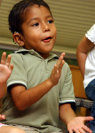 Image of a boy clapping his hands