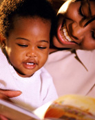 Image of a mother reading to her baby