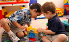 Image of a two boys playing with blocks.