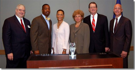 From left to right: Albert K. Blackwelder of Emory Crawford Long Hospital, Anthony L. Burfoot, Vice Mayor of The City of Norfolk, Chair Earp, Francine M. Tishman of Abilities, Inc., Ronald R. Peterson of Johns Hopkins Health System, Richard J. Morgante of the IRS.
