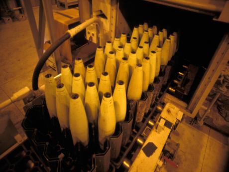 An empty projectile - A tray of empty projectile casings coming out of the metal parts furnace after being decontaminated during operations at JACADS.