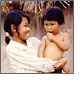 Link to Maternal and Child Health (Photo of a woman holding a young child)