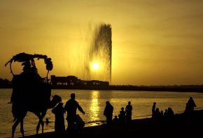 Date: 05/07/2004 Location: Jeddah, Saudi Arabia. Description: Vacationing Saudi Arabians are silhouetted at a public beach in Jeddah, Saudi Arabia near the Jeddah fountain, a landmark in the city.  � AP Photo