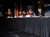 From the podium, Douglas Comstock, director of NASA's Innovative Partnership Program, moderates a panel presenting the topic “Unleashing the Power of Technology and Creativity” during NASA’s Future Forum in Miami.