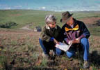suzie anderson and nrcs resource conservationist on the land