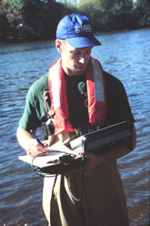 Scientist taking a surface water sample