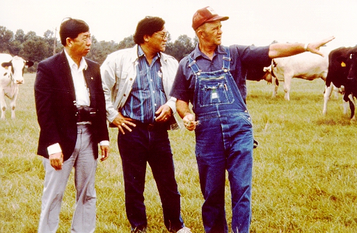 photo - three men in a cow pasture