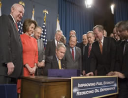 December 19, 2007 - Congressman Dingell joins with several Members of Congress watching President George W. Bush sign H.R. 6, the Energy Independence and Security Act of 2007, Wednesday, into law on Dec. 19, 2007. The signing took place at the U.S. Department of Energy in Washington, D.C.  White House photo by Joyce N. Boghosian