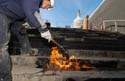 A worker uses a blowtorch to seal the tar layers of waterproofing material on the monumental steps located on the south side of the CVC entrance zone