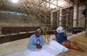 Workers review mechanical drawings in the south Orientation Theater