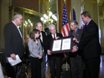 Senator Harkin, Congressman Boswell, Senator Grassley and Governor Culver present the official bill to the Omvigs