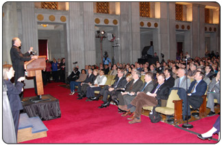 Secretary of the Interior Ken Salazar addresses a packed auditorium at the Department's Headquarters. [Photo Credit: Rick Lewis, NPS]