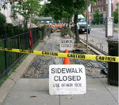 Urban sidewalk under construction.