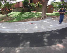 Case Study: Photo of combined curb ramp at hilly intersection.