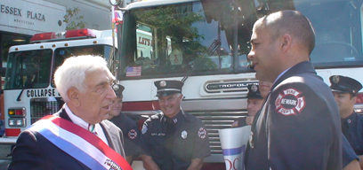 Senator Lautenberg speaks with some of Newark's firefighters at the 47th Annual Puerto Rican Heritage Statewide Parade. The parade has become the largest in Newark with approximately 3,000 participants and 25,000 spectators. This year's parade was in honor of Major League Baseball Hall of Famer and humanitarian Roberto Clemente. (September 21, 2008)