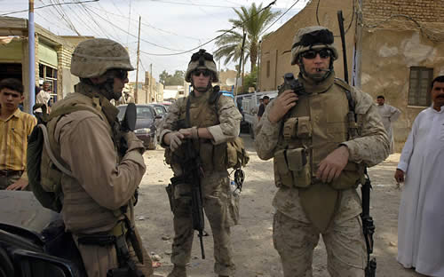 U.S. Marines patrol the streets of downtown Fallujah, Iraq; photo provided by Idaho native Vaughn Ward, who is pictured on the right.