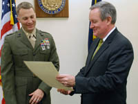 Senator Crapo presents a copy of the Congressional Record Statement honoring Major Vaughn Ward to Major Ward.