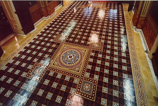 The tiles in this photograph have been polished to a high lustre, reflecting the overhead lights.